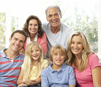 Extended Family Relaxing At Home Together